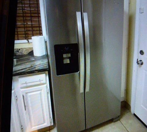 2 YEAR OLD STAINLESS STEEL FRIGE WITH ICE MAKER