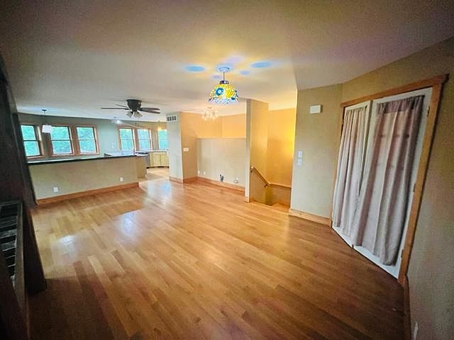 living area looking into kitchen / dining
doors go to airlock entry
all finished white oak floors
very open floor plan
