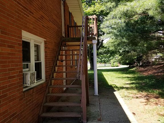 Back stairway access to the second level of the apartment.