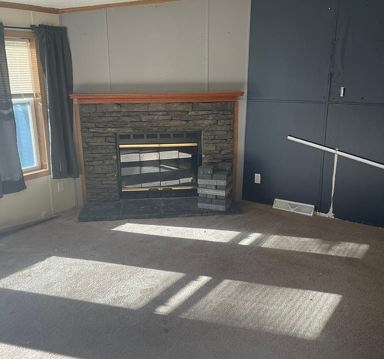 Living room with wood burning fireplace