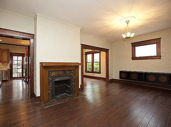 Fireplace has iron surround for gas stove