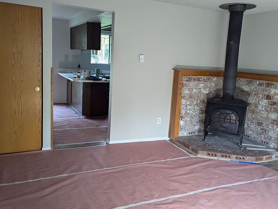 Wood stove saves $$ on your electric heat costs. 
Paper was on floor for painting, Same floor as other photos. Excellent shape.