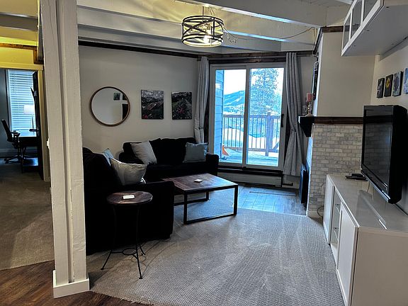 Living space with view to bedrooms and TV.