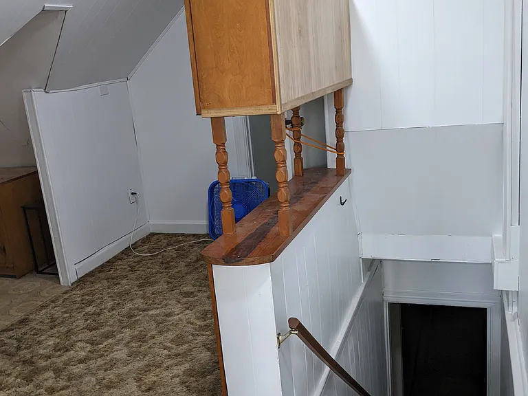 Third floor, office/playroom with a convenient half bathroom