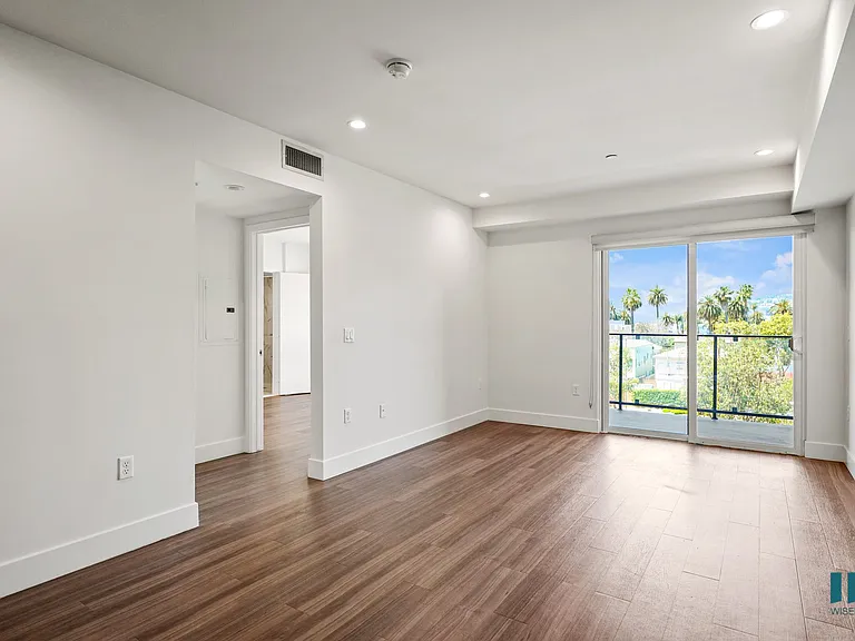 Living Room Area with Vinyl Flooring, Recessed Lighting, and a Patio