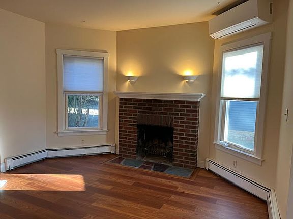 Dining Room or Family Room with wood-burning stove and split a/c