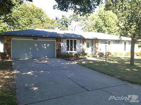 Front of this charming house with lots of mature shade trees in the much desired Ravenwood!