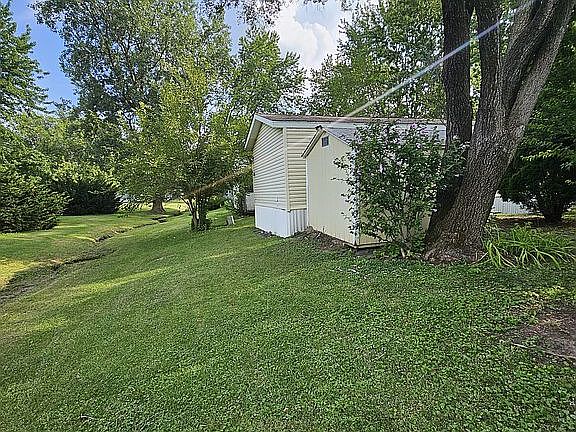 Back of yard with storage sh