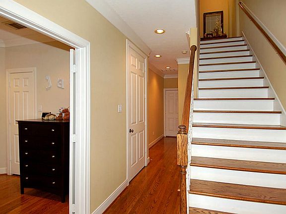 Downstairs is two bedrooms and a full bath. Through the hallway door on the left is currently closet space, but can be elevator shaft.