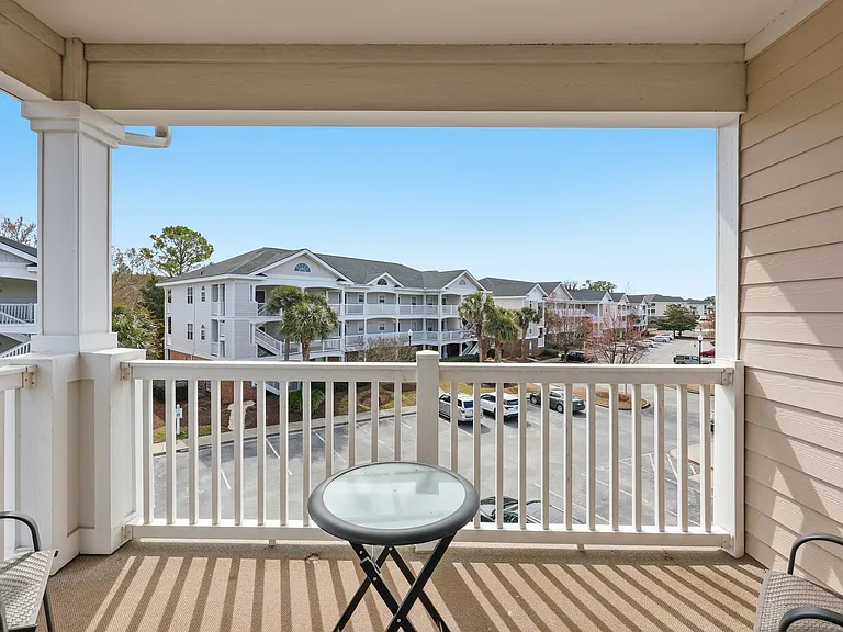 Balcony with peaceful neighborhood views.