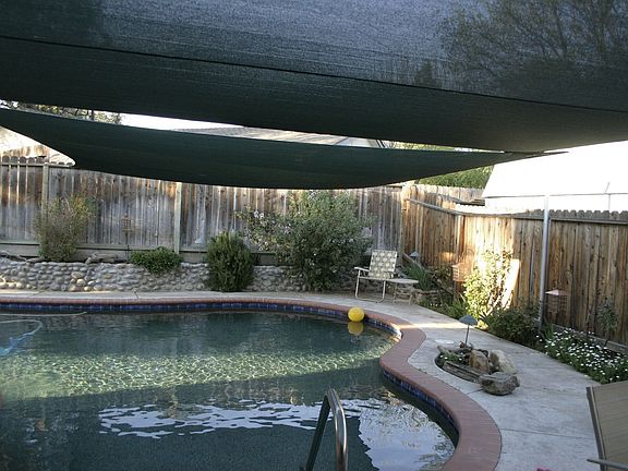 94 perimeter feet, pebble-tech, self-chlorinated, solar-heated pool.