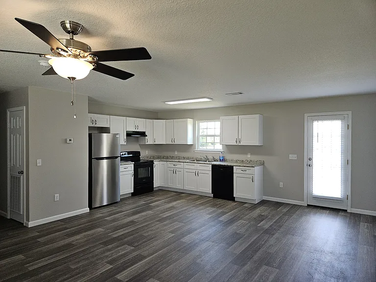 Large kitchen, den, dining area with brand new fridge, stove, oven, dishwasher