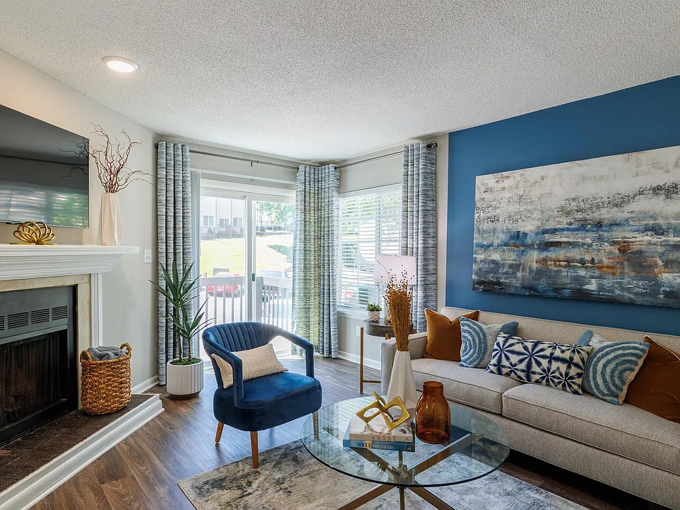 Spacious living room with hardwood-style flooring & fireplace