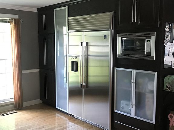 Kitchen has lots of pantry space and nice appliances.