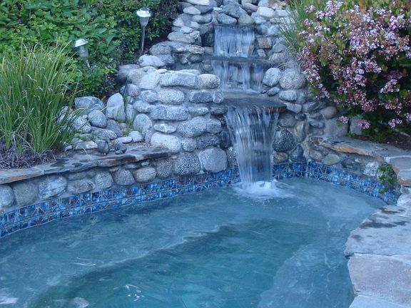 Spa with waterfall in back