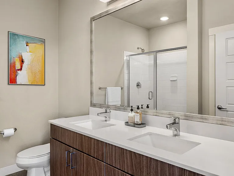 Bathroom with Dual Sink Vanity and Walk-In Shower