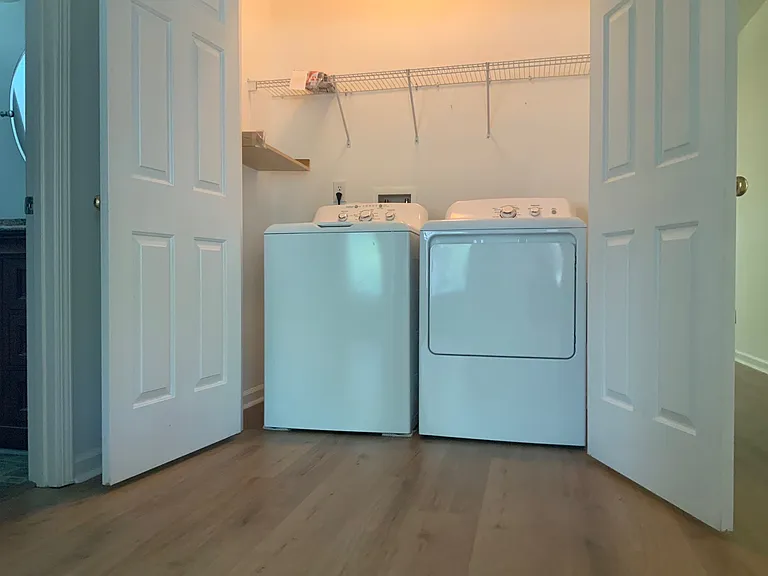 laundry with matching flooring