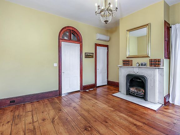 Front room was once a law office, barbershop, art handling and shipping company and home/office for Spherical, a communications firm.