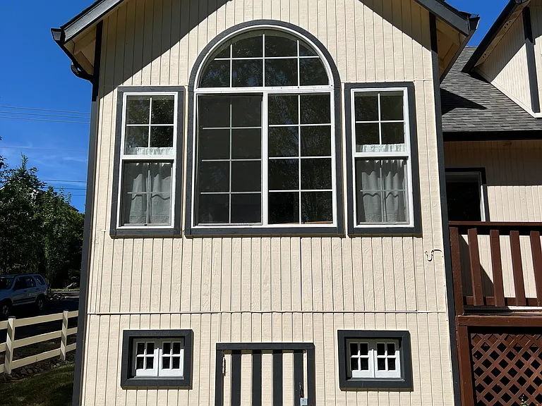 Fireplace room picture window facing greenspace. Garden shed beneath