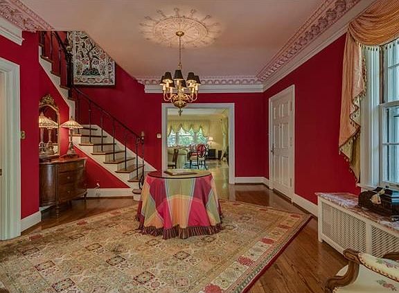 Upon entering the home a sense of timeless grace and elegance envelopes you!  Custom carved millwork and attention to detail is a standard feature throughout the home