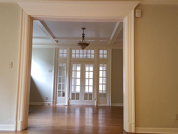 Looking through living room toward sunroom