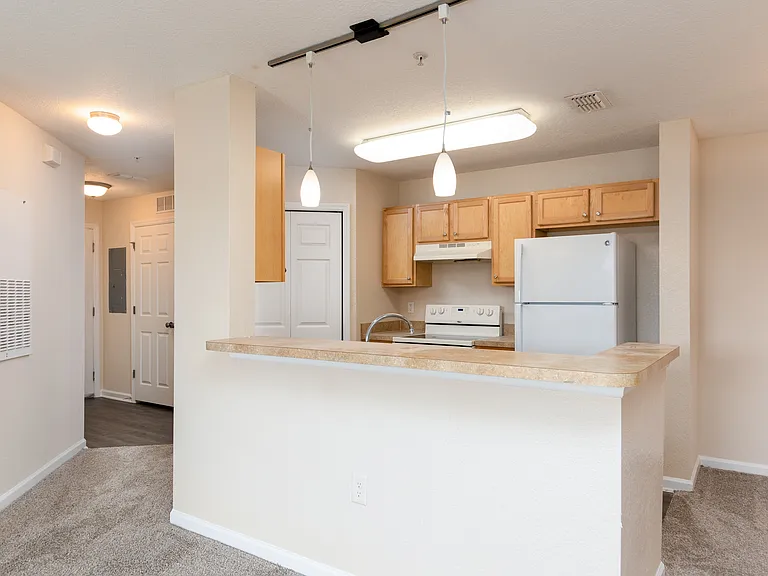 Open-concept kitchen with breakfast bar.