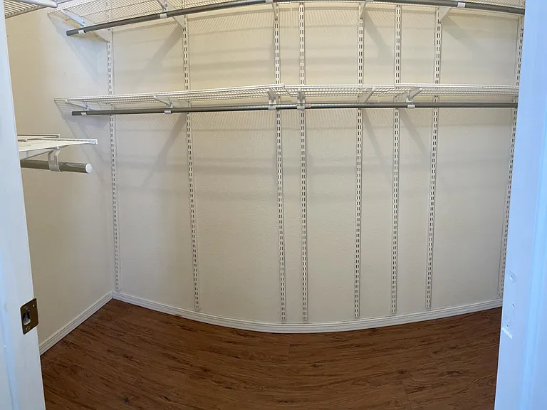 Upstairs floor primary walk-in closet