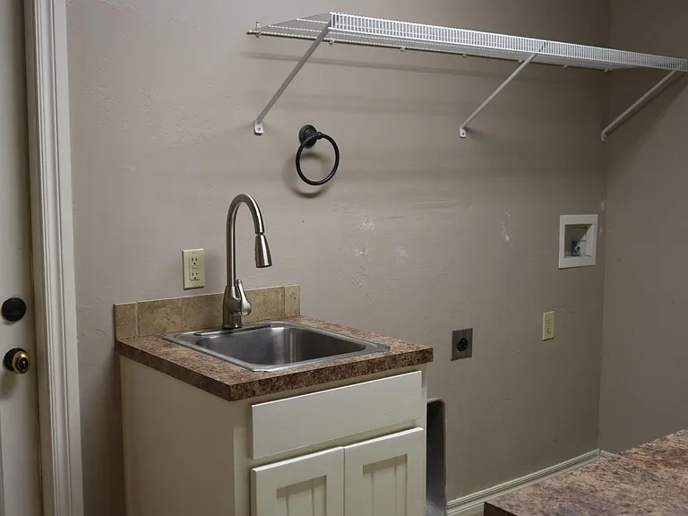Laundry room, storage shelves, sink, food pantry closet