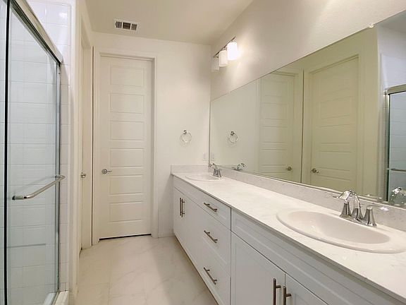 Main Bathroom with access to walk in closet.