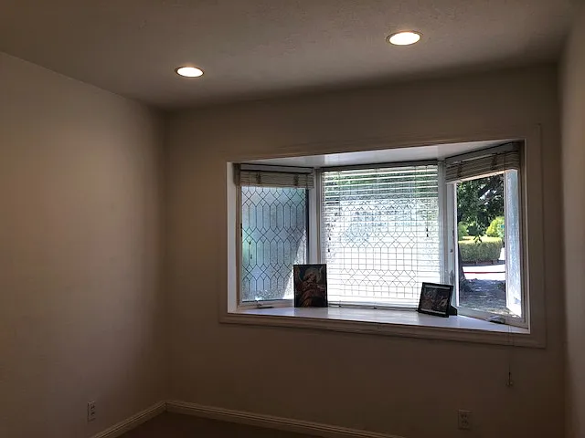 Bedroom #3: Giant size bay windows, built in ceiling lights, new carpet and fresh wall paint