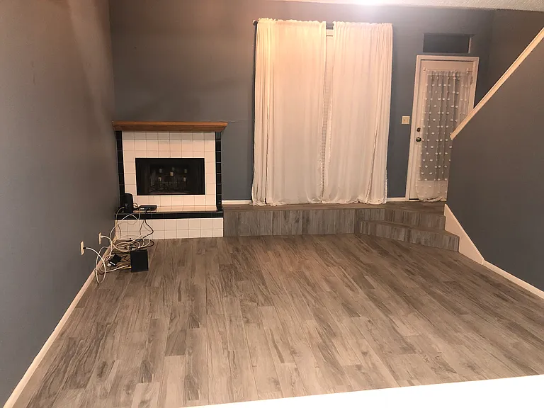 Living room * 5 am so pictures are darker 
Porcelain tile wood look planks throughout downstairs and upstairs