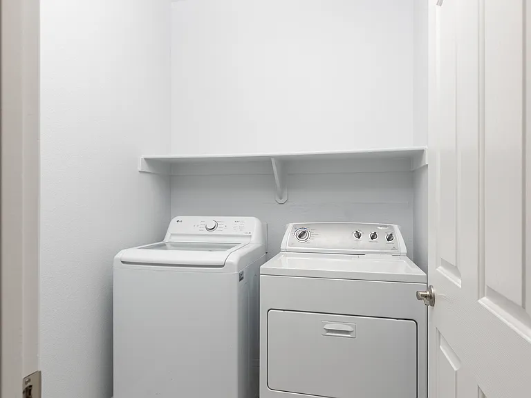 Laundry room with washer and dryer included