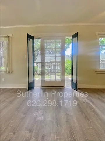 Front door with beautiful glass screened panels that open to let in the breeze - 1407 Prime Ct