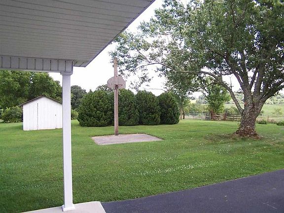 Back yard - Basketball hoop gone replaced with swing