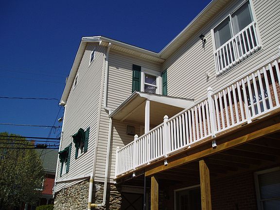 Side of house showing new deck and MBR french doors