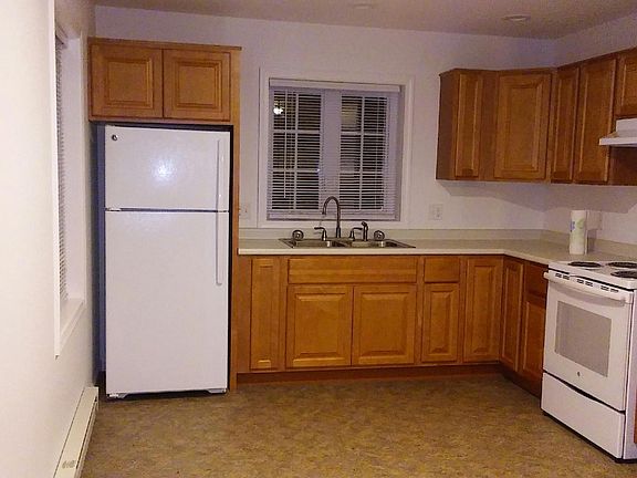 Spacious Kitchen with lots of cabinet space, stove, and refrigerator included.