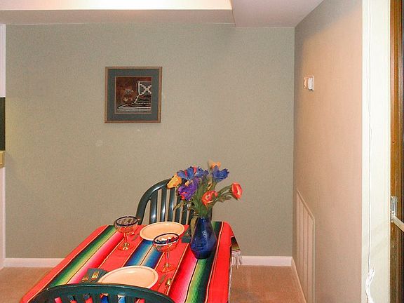 Dining area large enough to accomodate table and hutch or corner cabinet,