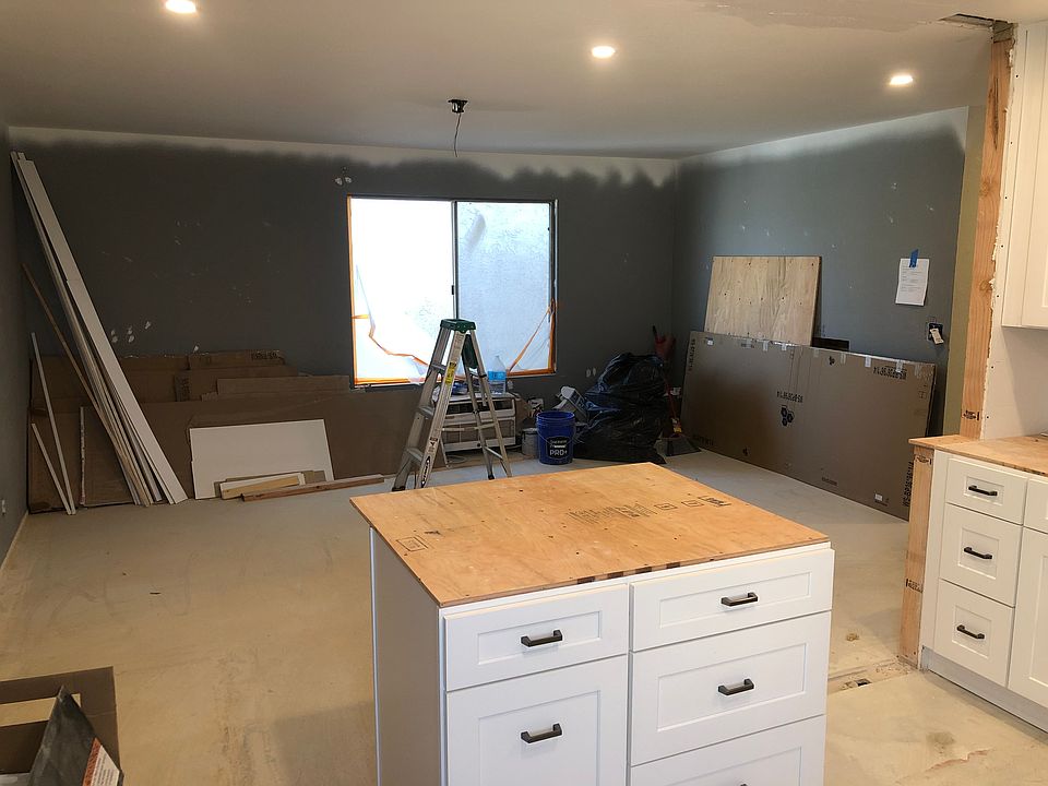 View from kitchen into living room. Next: new carpet, new paint, new blinds.