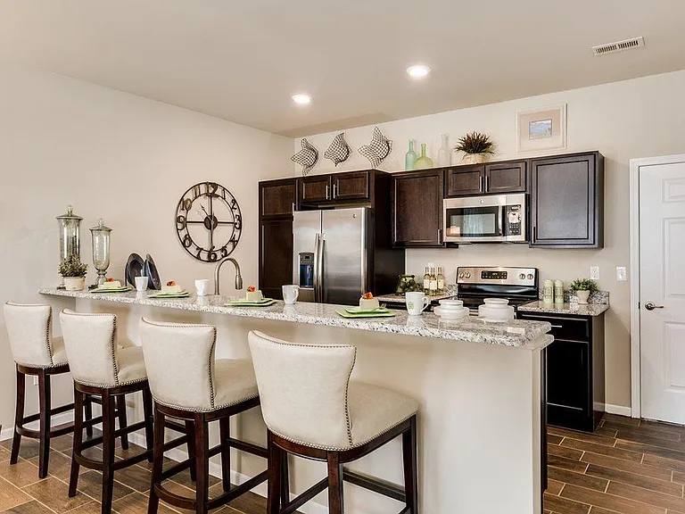 Luxury Kitchen with Elegant Cabinetry, Stainless Appliances, Features and Breakfast Bar