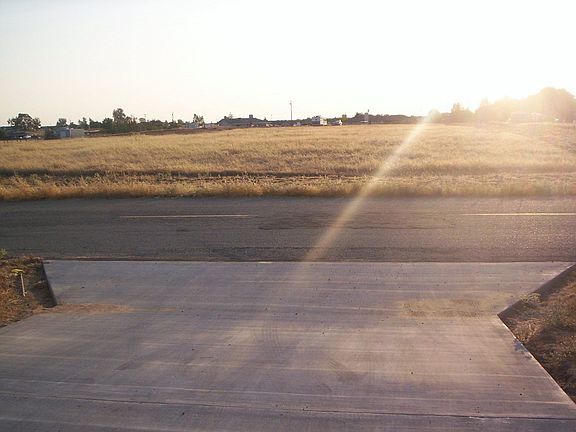 View from driveway into lot across the street