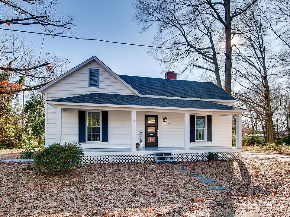 Charming Home with covered rocking chair front porch.