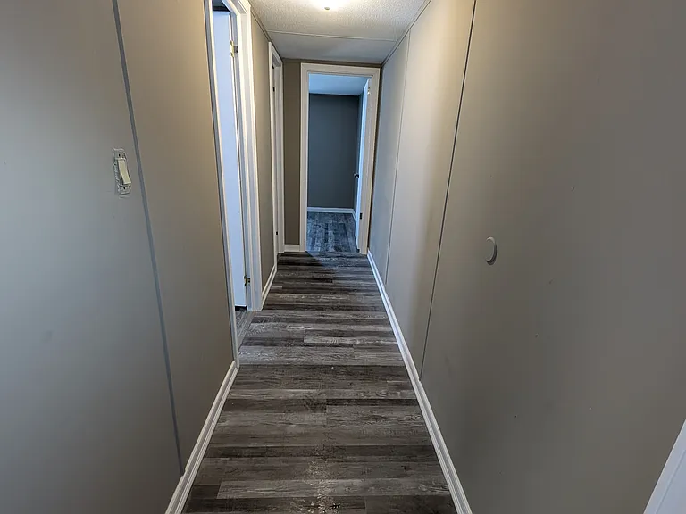 Hallway to 2 bedrooms and 1/2 bath