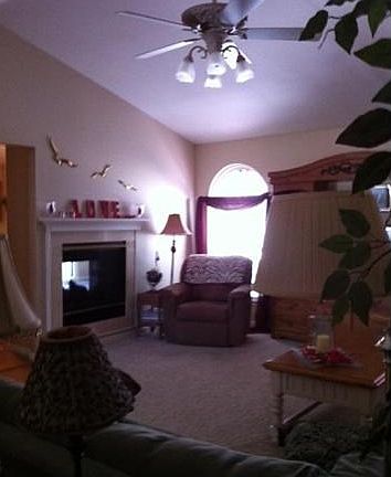 View of fireplace with mantel and marble surround. Vaulted ceil