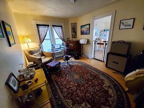 From hall, facing a bonus room (makes a great dining or office) with kitchen to the right beyond pet gate