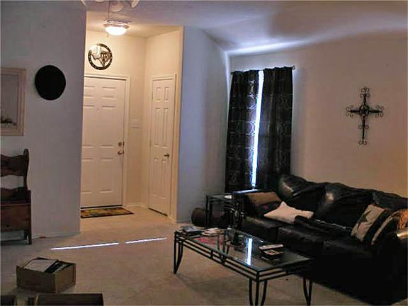  Living room looking from kitchen toward front entry.