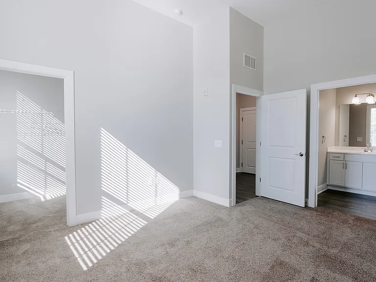 Step into serenity with this inviting bedroom, complete with a walk-in closet and modern en-suite bathroom.