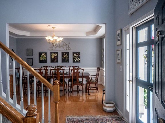 Entry with wooden storm door