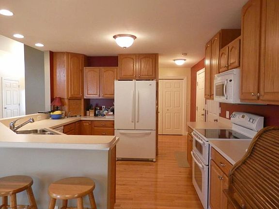 Oak cabinets plus pantry in neat & clean kitchen