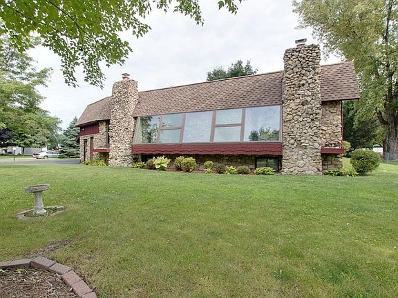 Huge wall of glass overlooks the front yard and offers the option of indoor plantings gaining loads of sunlight!
