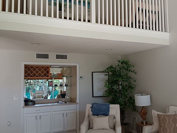 Living Room w/ View of Loft and Wet Bar